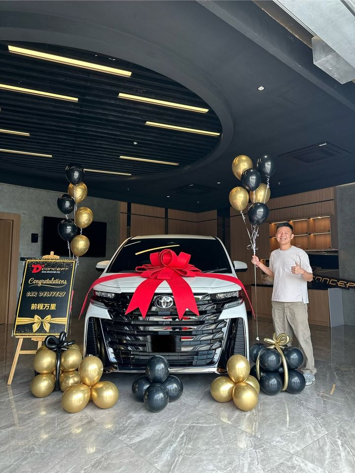 White Toyota Alphard handover with gold balloons